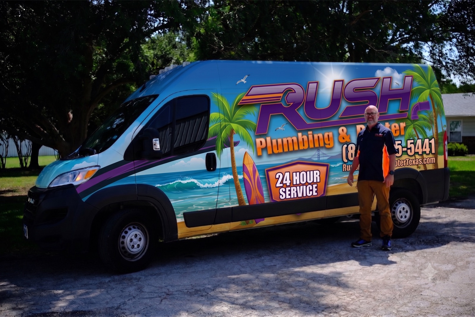 Rush Plumbing and Air founder Bill standing beside the wrapped Rush service van with its 24 hour service graphics